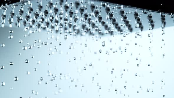 Super Slow Motion Shot of Water Droplets Falling From Shower Head at 1000Fps alt
