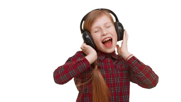 Lovely Active Elementaryschool Aged Caucasian Girl Listening Music Through Headphones Dancing alt