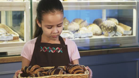 Adorable Little Girl Wearing Apron Working at the Bakery Smiling To the Camera