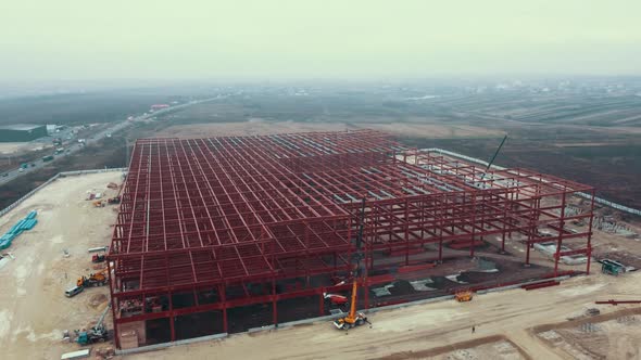 Construction Site of Steel Frame Structure Aerial Back Fly alt
