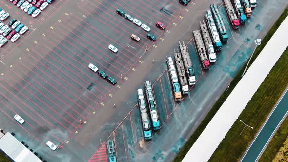 Loading New Cars Onto Trucks for Transportation Aerial View alt