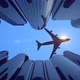 Airplane Flying Low Over Skyscrapers - VideoHive Item for Sale