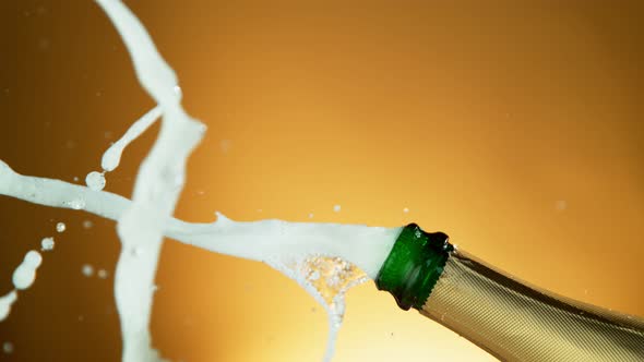 Super Slow Motion Shot of Champagne Explosion on Golden Luxury Background at 1000Fps alt