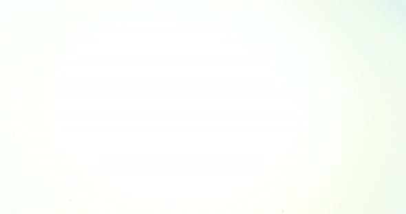 Blue Liquid falling into Water against White Background, Slow motion 4K alt