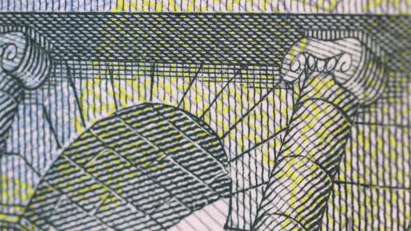 Five euro bill surface extreme detail, macro shot close up. Clockwise rotation of european currency alt