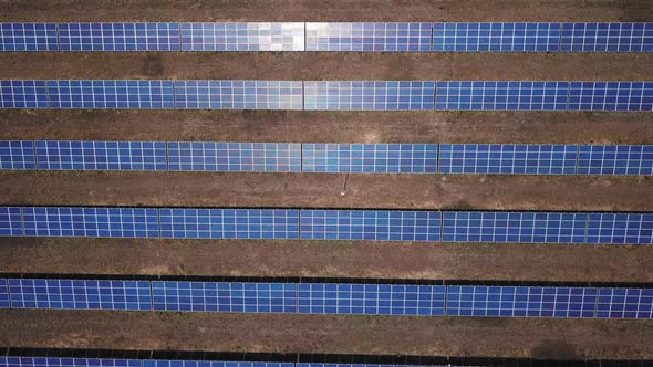 Aerial Top Down View of Solar Power Station Field at Sunny Day. Aerial Top View of Solar Farm alt