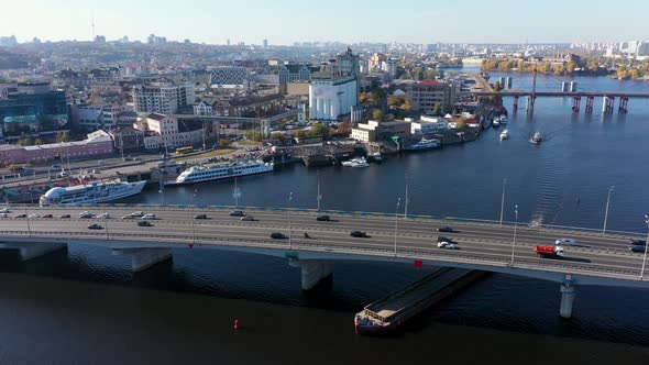 Cargo Barge Sailing Under The Havansky Bridge. City Traffic On The Bridge