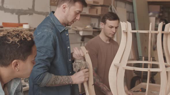 Woodworkers Building Furniture in Workshop alt