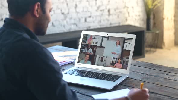 Indian Guy Using Laptop Computer for Video Call alt