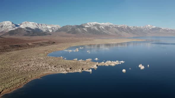 Aerial View of USA Nature Park. Smooth Surface of Ancient Lake with Blue Sky  alt