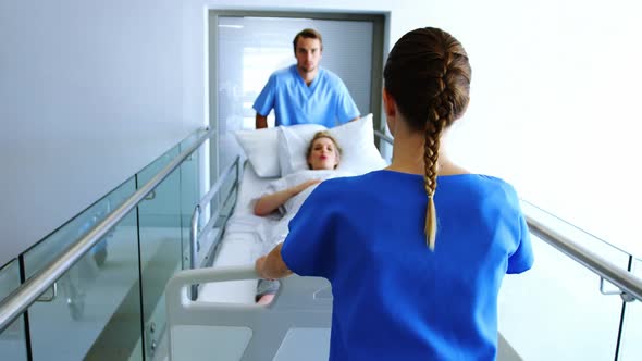 Team of doctor taking pregnant woman to operation theatre alt