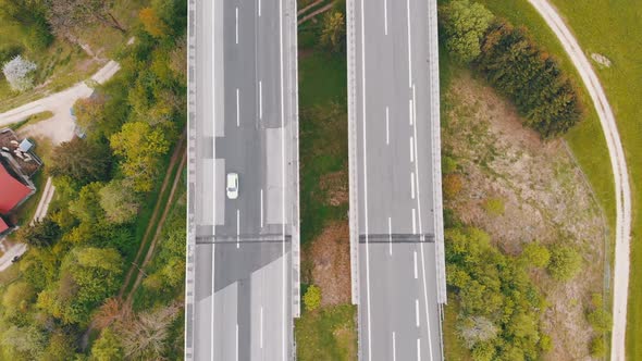 Aerial Top View of Highway Viaduct with Multilane Traffic in Mountains. Autobahn in Austria alt
