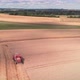 Combine harvester working on golden wheat field - VideoHive Item for Sale