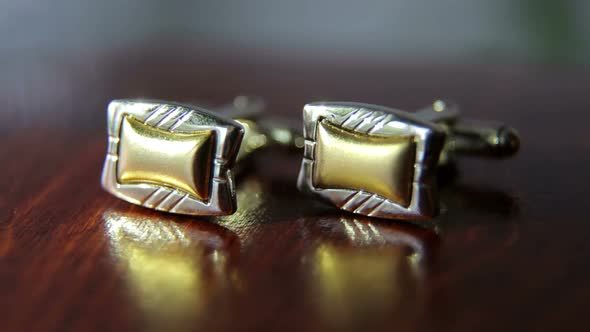 Closeup of Men's Cufflinks for Shirt on a Table alt