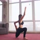 Young Brunette Woman with Ponytail Doing Yoga Meditating Practicing Pose at Home - VideoHive Item for Sale
