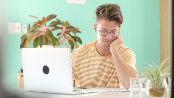Close Up Focused Businessman Working on Laptop Computer in Home Office alt