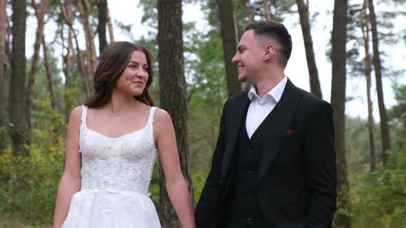 Young Sexy Couple Expressing Feelings in the Park alt