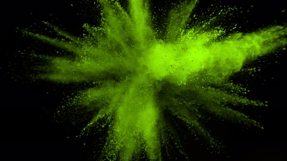Super Slowmotion Shot of Green Powder Explosion Isolated on Black Background at 1000Fps alt