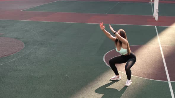 Fit Young Woman Is Training Doing Squats on Stadium in College Campus, Workout.