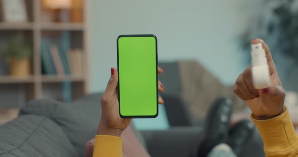 Woman Using Green Screen Mobile for Video Talk with Doctor alt