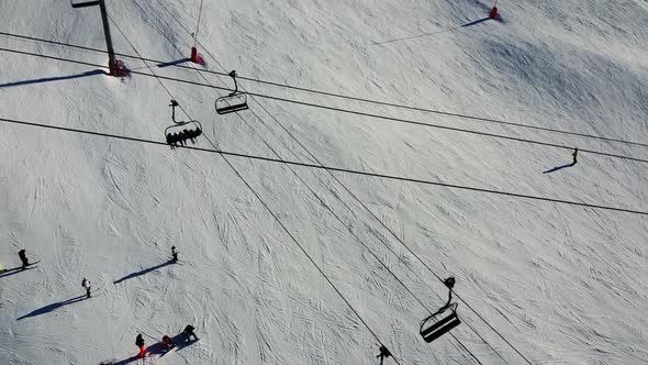 Aerial View of the Alps Mountains in France. Mountain Tops Covered in Snow. Alpine Ski Facilities