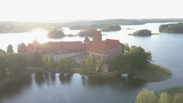 Flight Over Beautiful Trakai Castle at Sunset in Summer Season. Aerial View of Beautiful Castle on alt