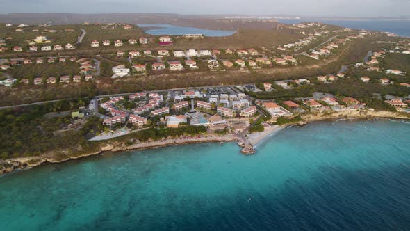 Aerial establishing shot of the big resort on the tropical island alt