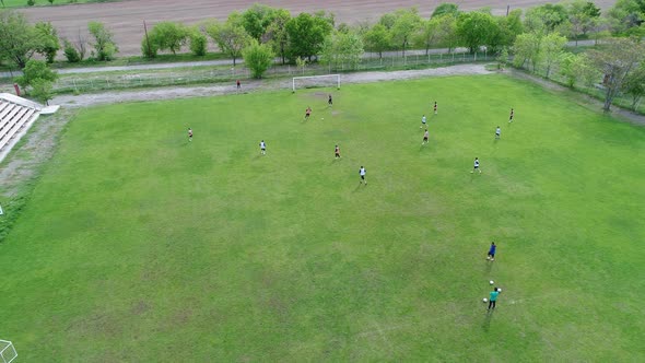 Teenagers having training on football field