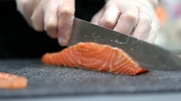 Crop Chef Cutting Fresh Salmon