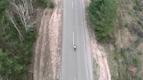Cyclist biking on bicycle alt