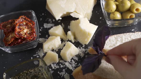 Video of Traditional Italian Food  Parmesan Cheese Dried Tomato and Olive alt