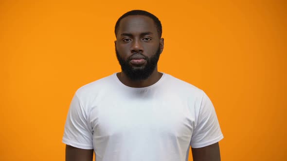 Afro-American Man Showing Stop Sign alt