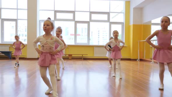 Group of little girls practicing in ballet school