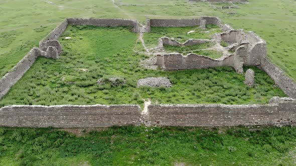 Ruins of Ancient City, Building and Wall From Ancient Times in Treeless Vast Plain alt