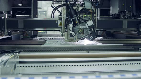 Surface Mount Technology SMT Machine places components on a circuit board