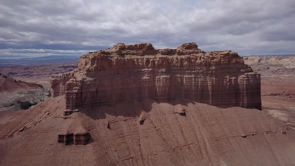 Flying high next to Wild Horse Butte on cloudy day alt