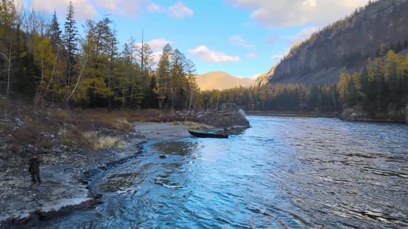a Man Fishing on the Banks of a Picturesque River Panorama of the Water