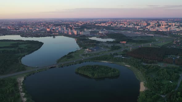 Top View of the Drozdov Reservoir and the Ring Road in Minsk at Dawn alt