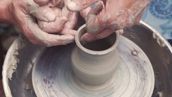 Grandmother with a Grandchildren Make Pitchers in Pottery alt