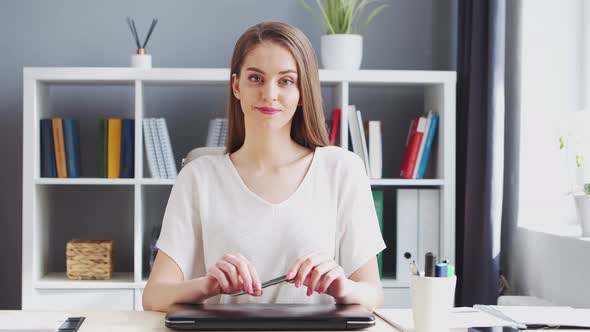 Young Woman Works at Home Office Using Computer. alt