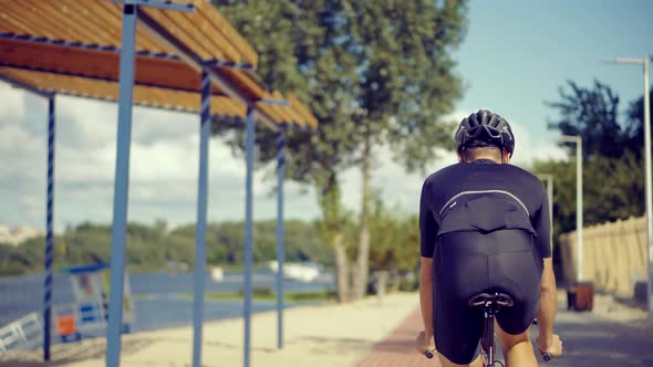 Sport Recreation Bike Cycling On Summer Time. Cyclist In Helmet Riding On Sunset. alt