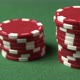 A Closeup Poker Shot of Color Chips Man&#39;s Hand Doing a Bet Red Chips Sliding Toward Camera - VideoHive Item for Sale