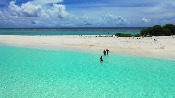Women happy together on idyllic sea view beach time by aqua blue water and clean sandy background of alt