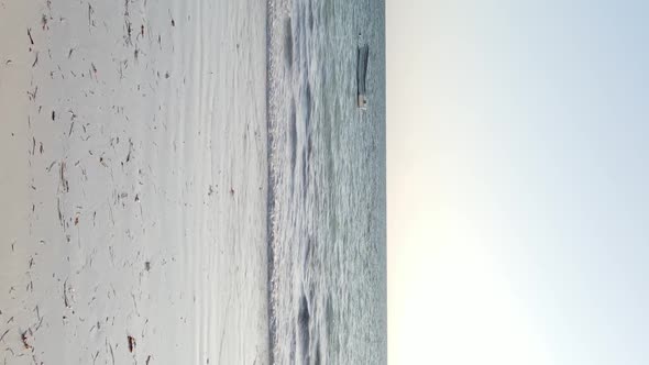 Tanzania Vertical Video  Boat Boats in the Ocean Near the Coast of Zanzibar Aerial View alt
