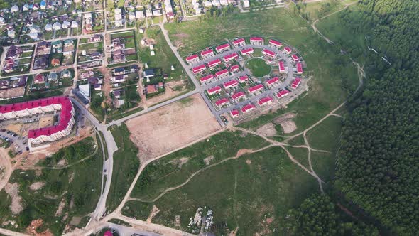 New Modern Cottage Village on the Outskirts of the City Aerial View alt