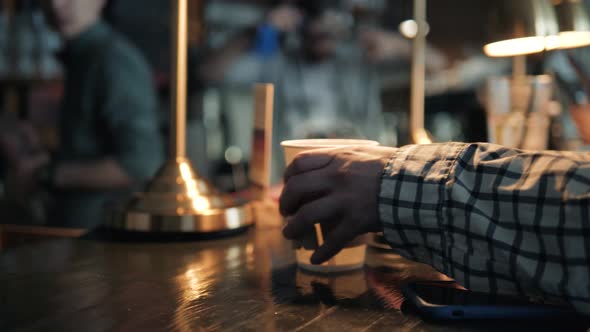 Closeup Shot of Unrecognizable Man Using Mobile Phone Nfc Payment Banking in Order to Pay for to Go alt