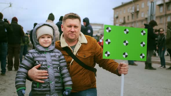 Family of Climate Change Activists at Rally with Mockup Banner alt