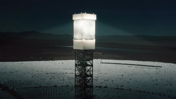 Cinematic Close Up Solar Tower Mirror Panel Accumulating Sun Beams at Sunset alt