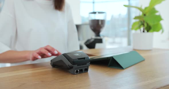 Man Hand with Smartwatch Using Terminal for Payment Noncash Transaction Side View alt