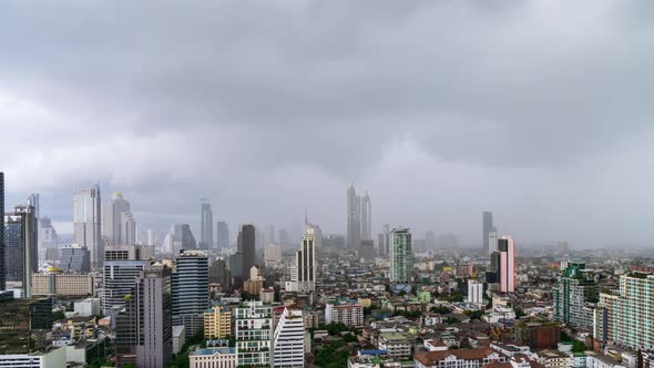 Bangkok business district during rain or rainstorm, zoom out - Time Lapse